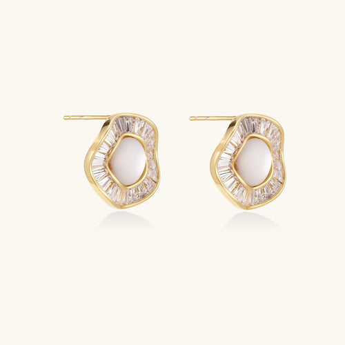 Round 14K gold-plated stud earrings with a mother of pearl center surrounded by baguette-cut crystals, 16mm.