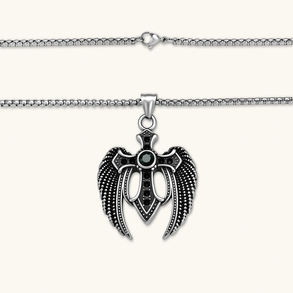 Silver stainless steel angel wing cross pendant necklace with green CZ center stone and black crystals on a box chain.