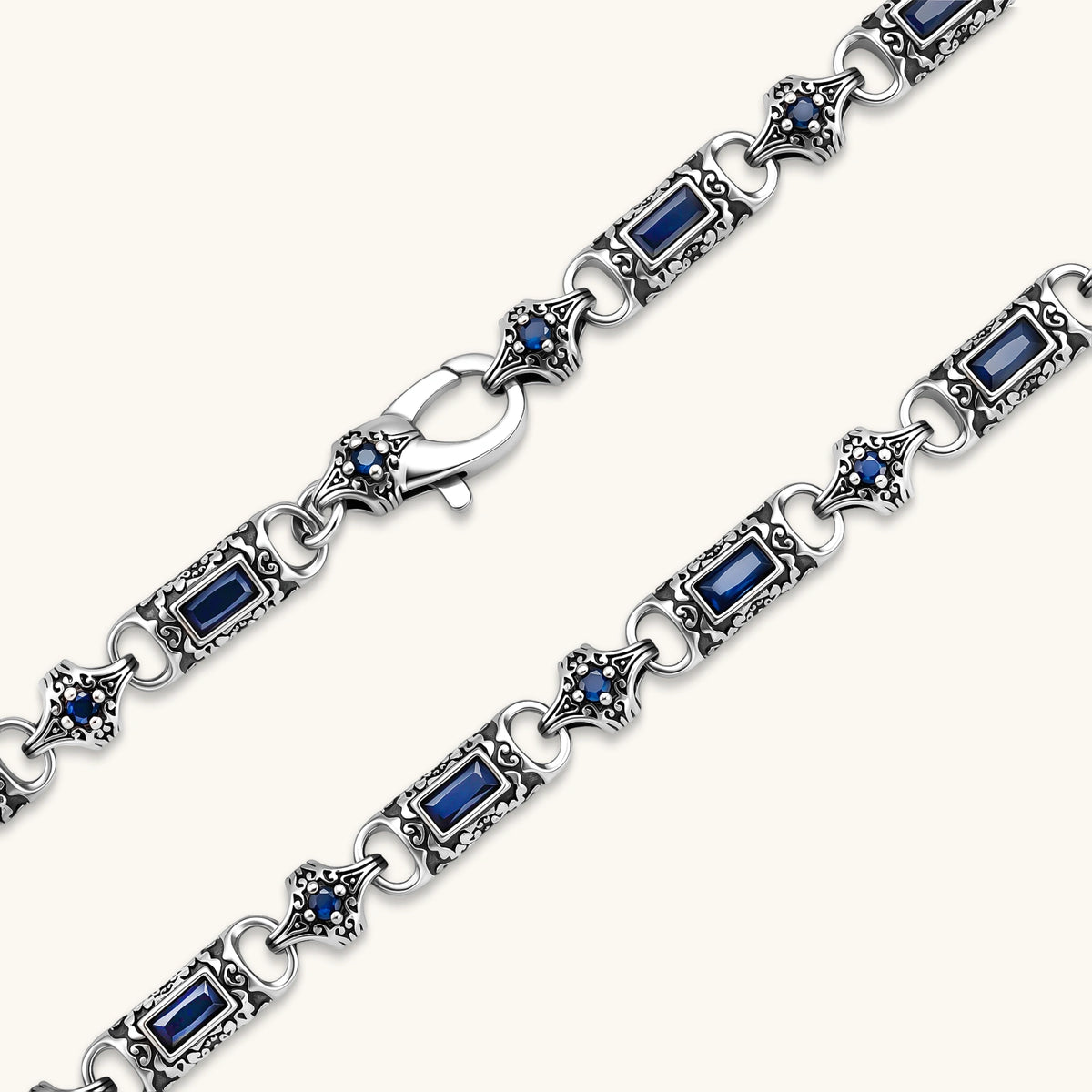 Oxidized silver 316L stainless steel chain necklace with rectangular navy CZ links and ornate gothic connector pieces, 640mm.