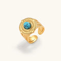 18K gold PVD stainless steel open signet ring with round turquoise cabochon, rope-twist border, beaded detail, multi-band shank.